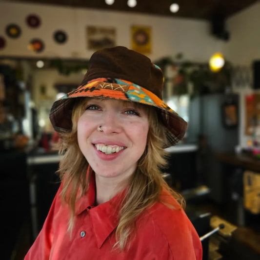 Upcycled mix Southwestern fleece turned into an Adult bucket reversible