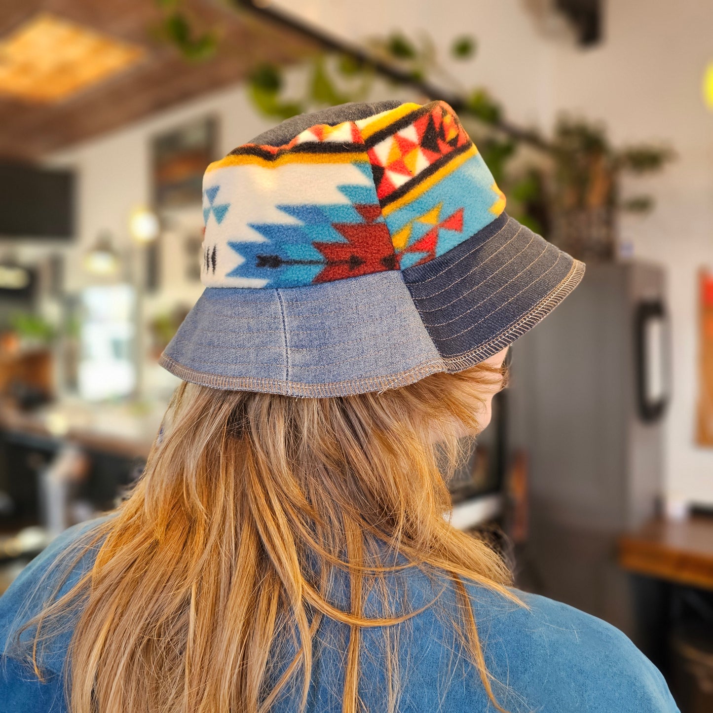 Upcycled mix Southwestern fleece turned into an Adult bucket reversible