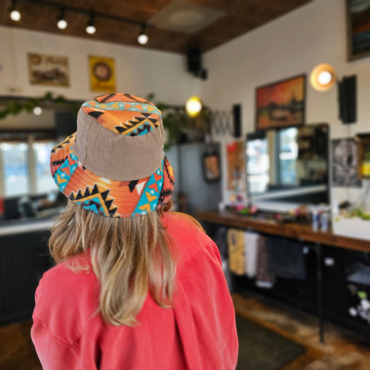 Upcycled mix Southwestern fleece turned into an Adult bucket reversible