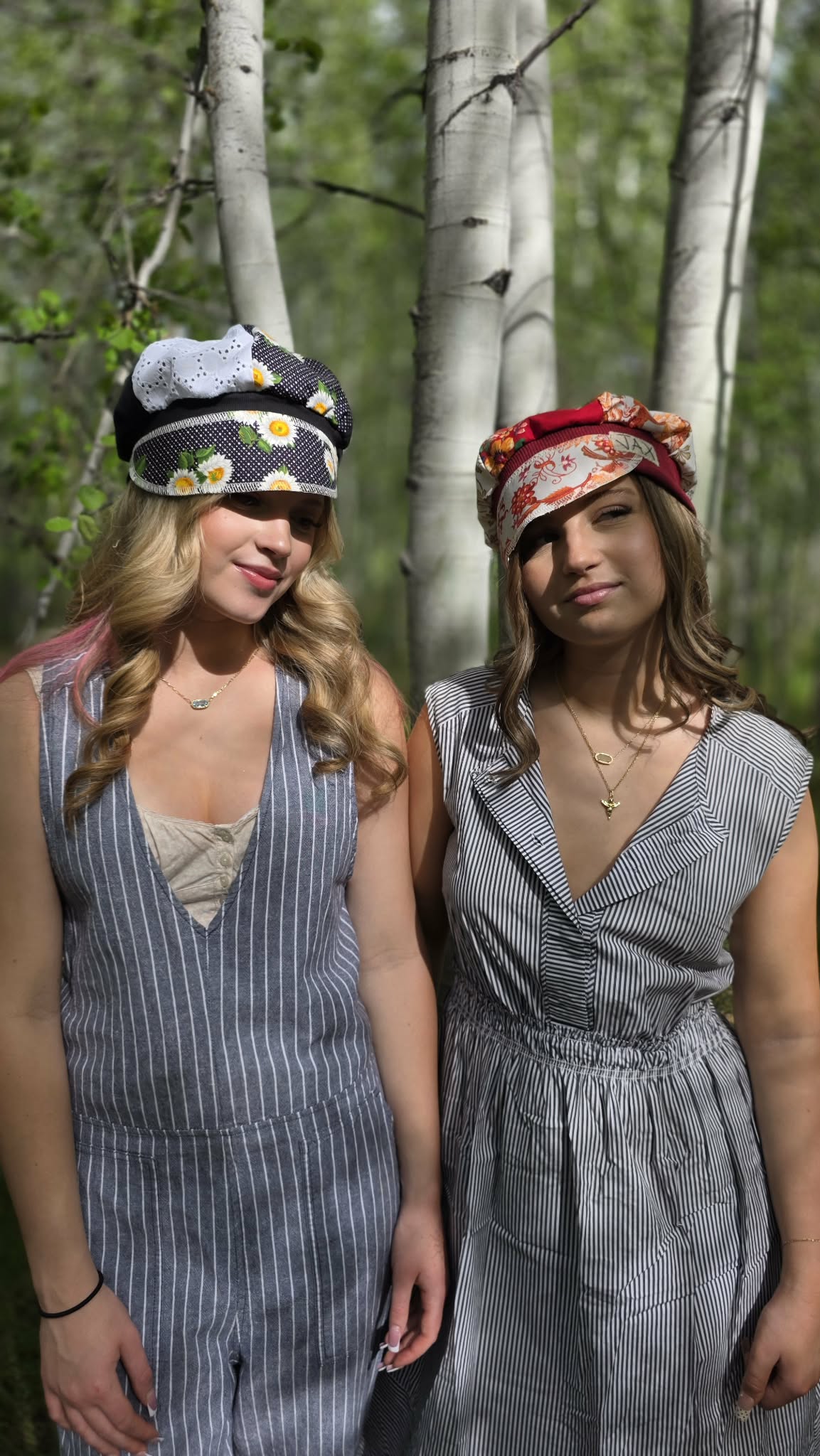 two girls in forest with hats
