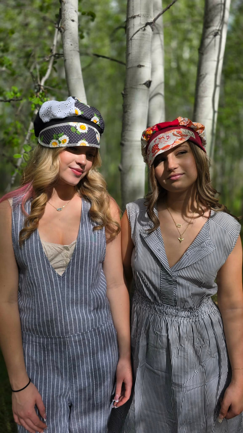 two girls in forest with hats