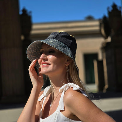 Upcycled sun hat made with black Denim jeans and Upcycled upholstery