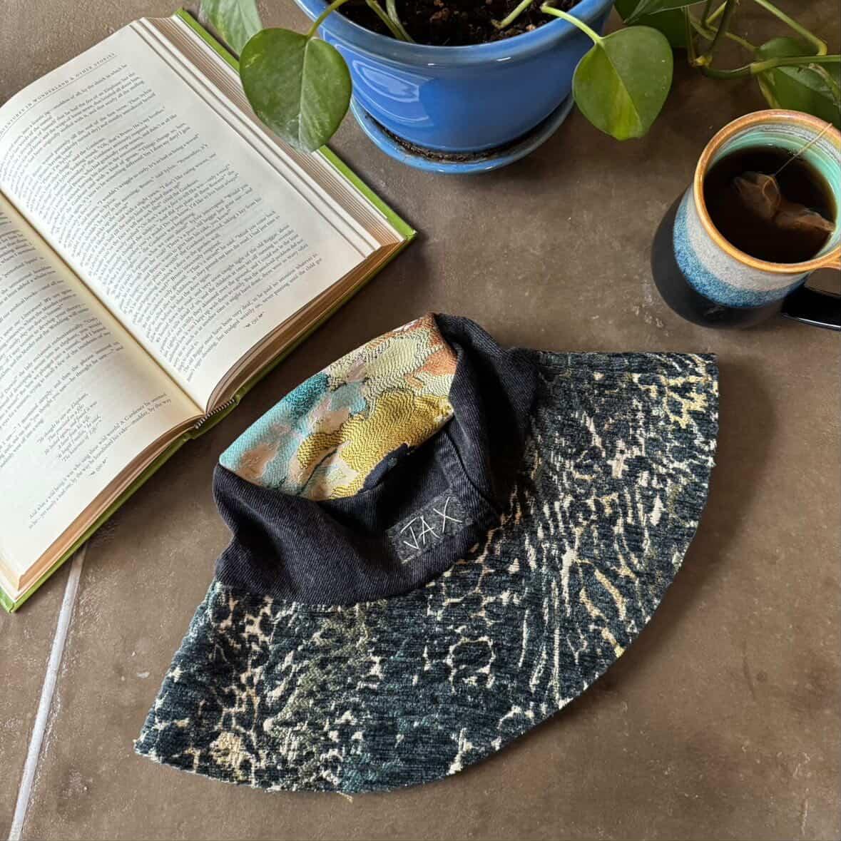 Upcycled sun hat made with black Denim jeans and Upcycled upholstery