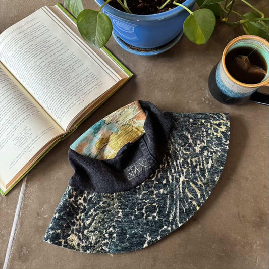 Upcycled sun hat made with black Denim jeans and Upcycled upholstery