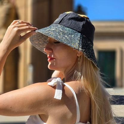 Upcycled sun hat made with black Denim jeans and Upcycled upholstery