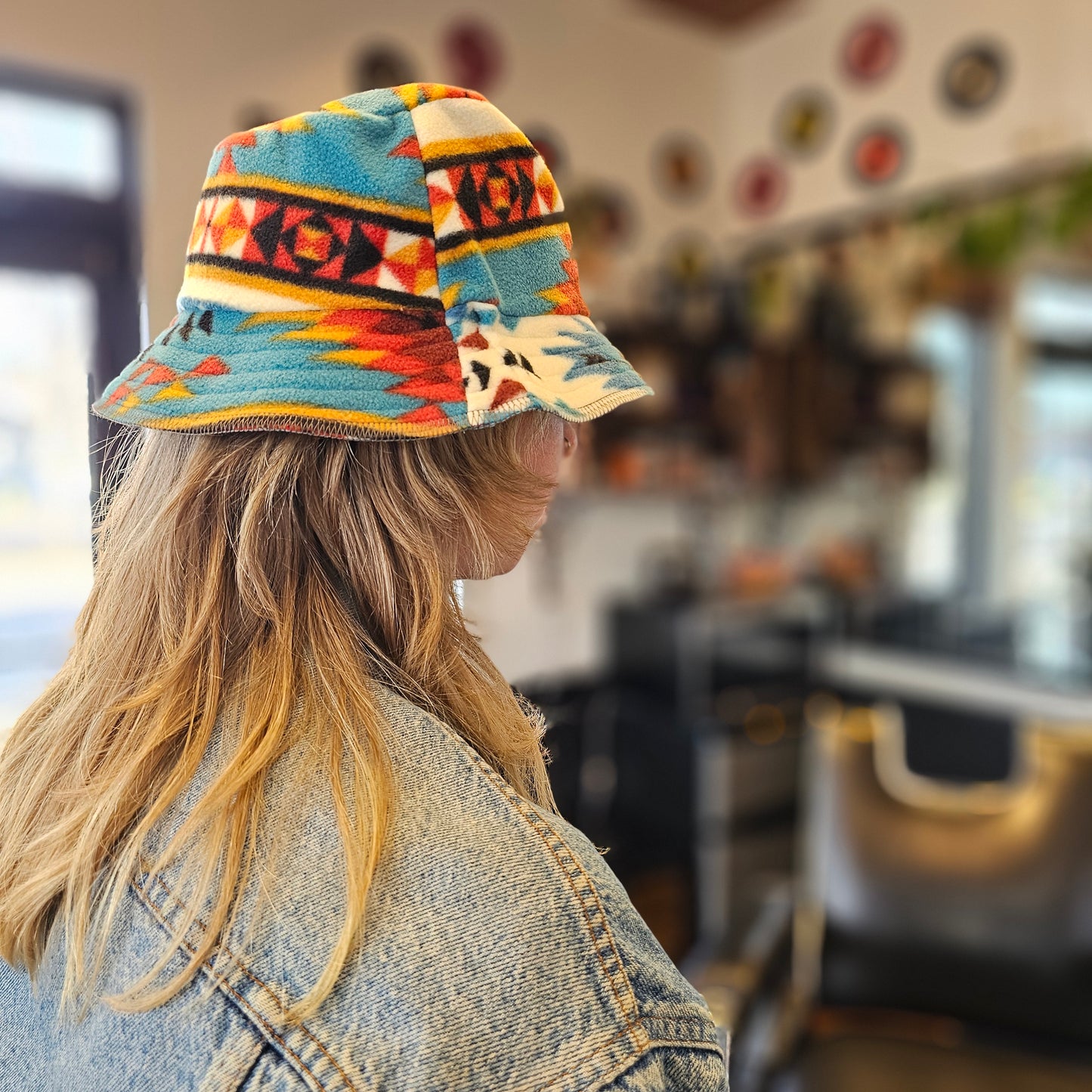 Upcycled solid Southwestern fleece turned into an Adult OS bucket reversible